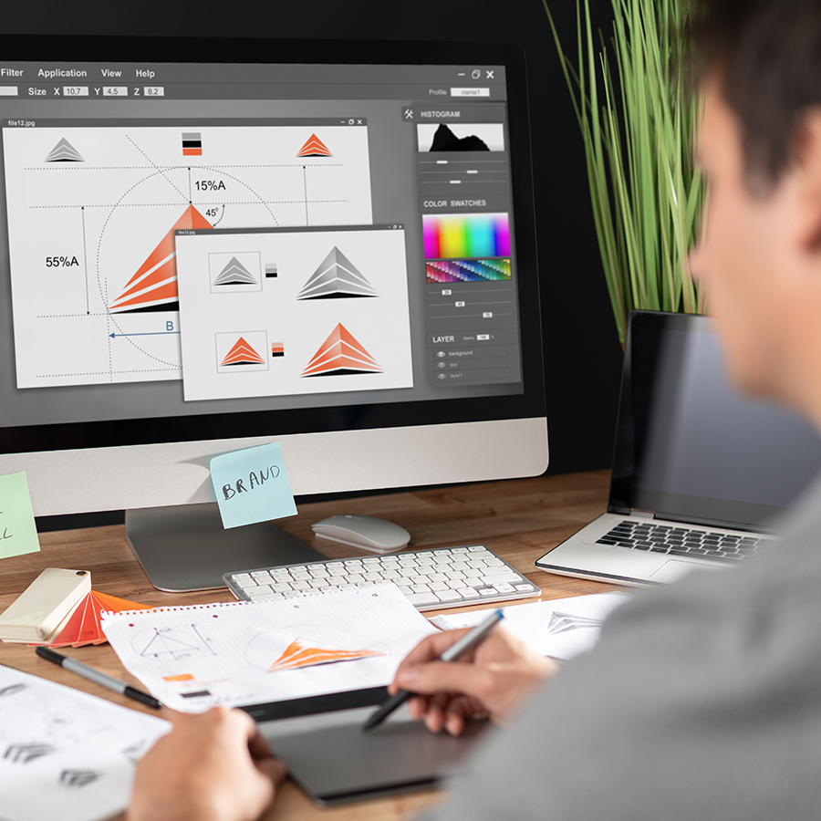 male doing graphic design on a computer