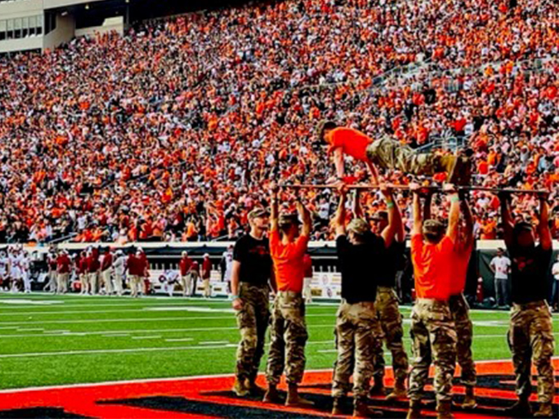 Clayton on the pushup board at an OSU ballgame