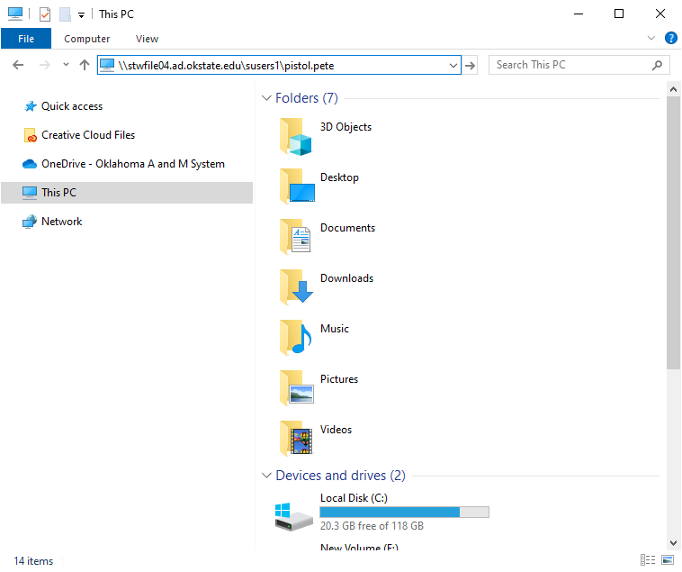 Screenshot of Windows File Explorer showing the path "\1stvfile04.ad.okstate.edu\users1\pistol.pete". Left panel includes Quick Access items like Creative Cloud Files and OneDrive. Right panel displays folders such as Desktop, Documents, and Downloads, along with drives Local Disk (C:) and New Volume (E:).