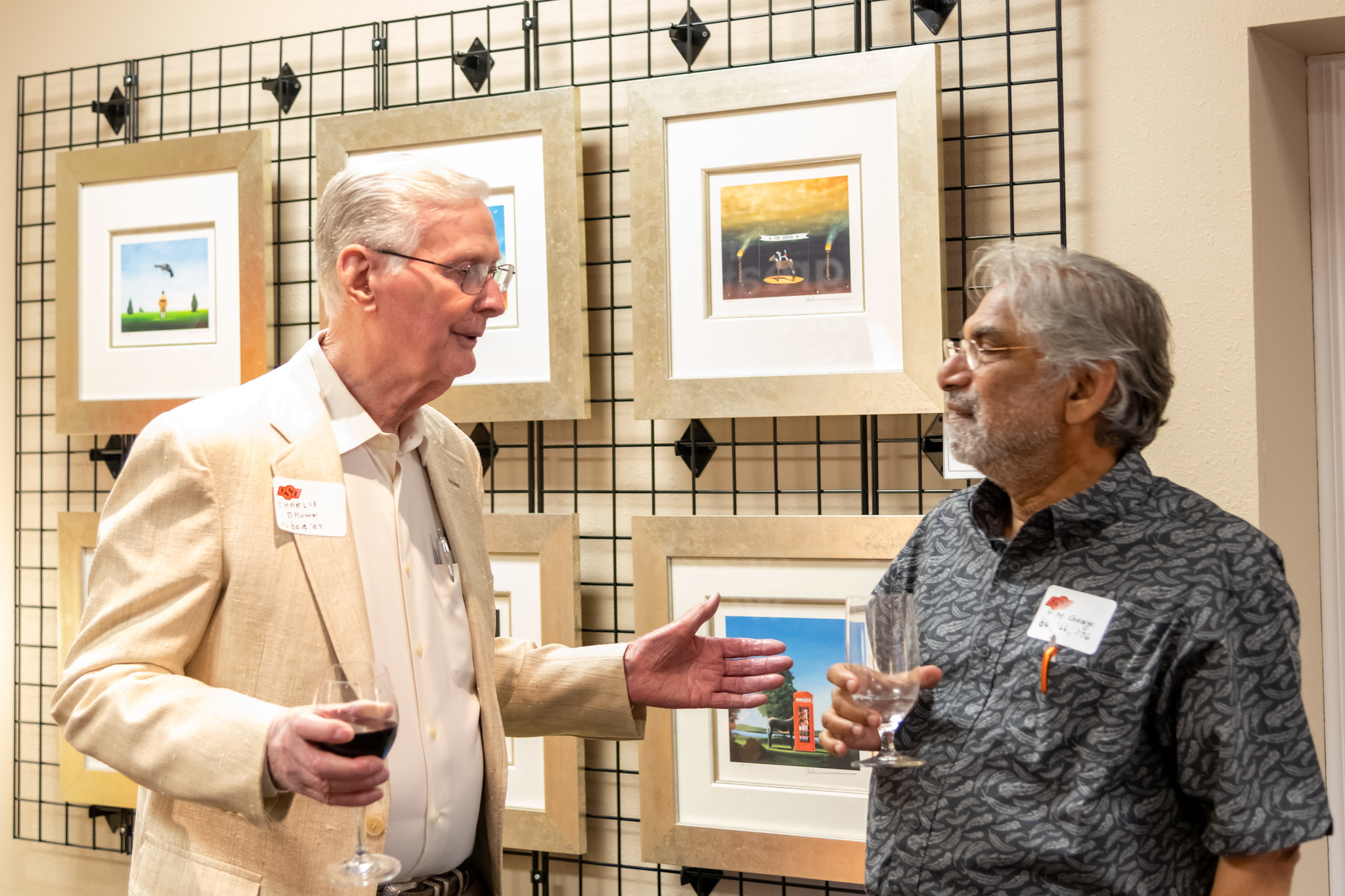 Charles Brown speaks with Department and Head K.M. George during Friday evening’s event