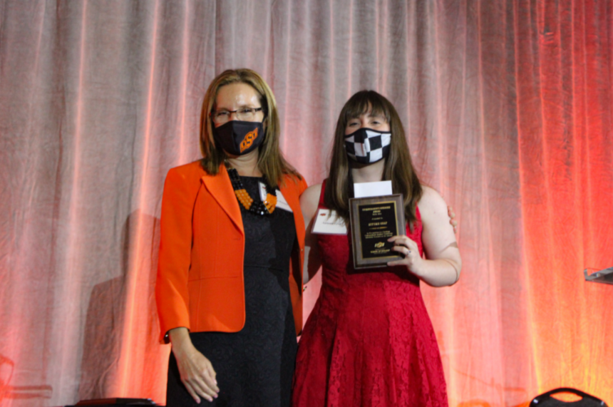 Dr. Camelia Knapp presenting an award to Ms. Autumn Graff. Dr. Camelia Knapp presenting an award to Ms. Autumn Graff.