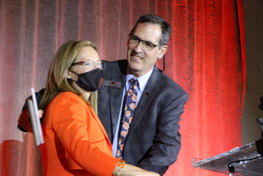 Dr. Camelia Knapp presenting an award to Dr. James Knapp. Dr. Camelia Knapp presenting an award to Dr. James Knapp.