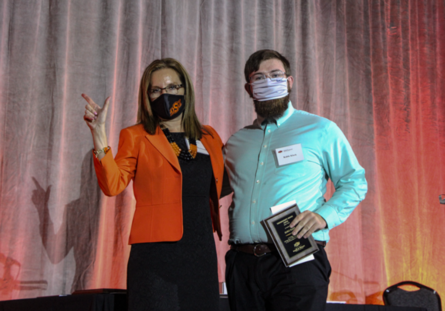 Dr. Camelia Knapp presenting an award to Mr. Kable Kleck. Dr. Camelia Knapp presenting an award to Mr. Kable Kleck.