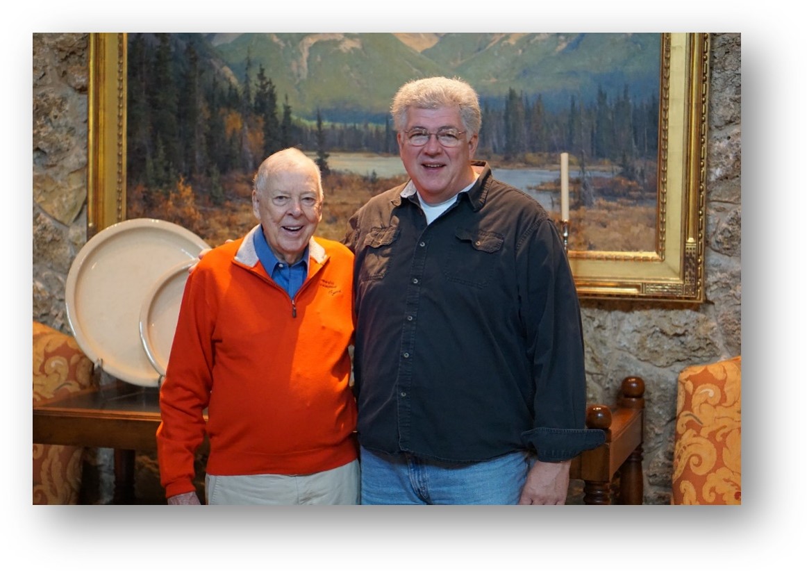Mr. Boone Pickens standing with Mr. Mike Kuykendall in front of a landscape painting waiting for their picture to be taken. Mr. Boone Pickens standing with Mr. Mike Kuykendall in front of a landscape painting waiting for their picture to be taken.