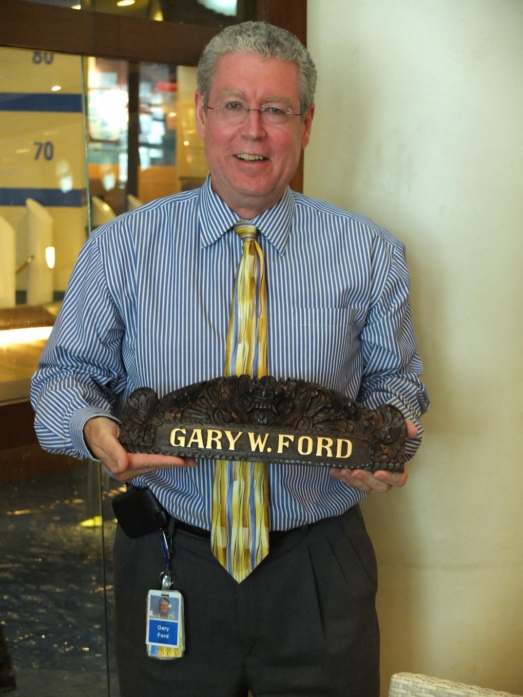 Mr. Gary Ford holding an award with his name on it. Mr. Gary Ford holding an award with his name on it.