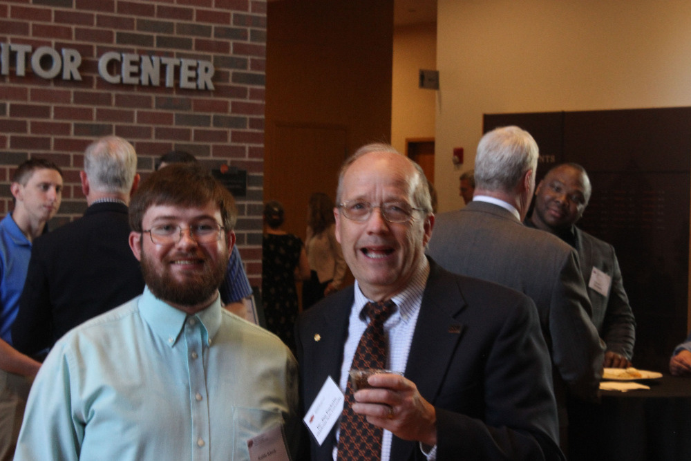 Mr. Kable Kleck and Dr. Jim Puckette visiting together. Mr. Kable Kleck and Dr. Jim Puckette visiting together.