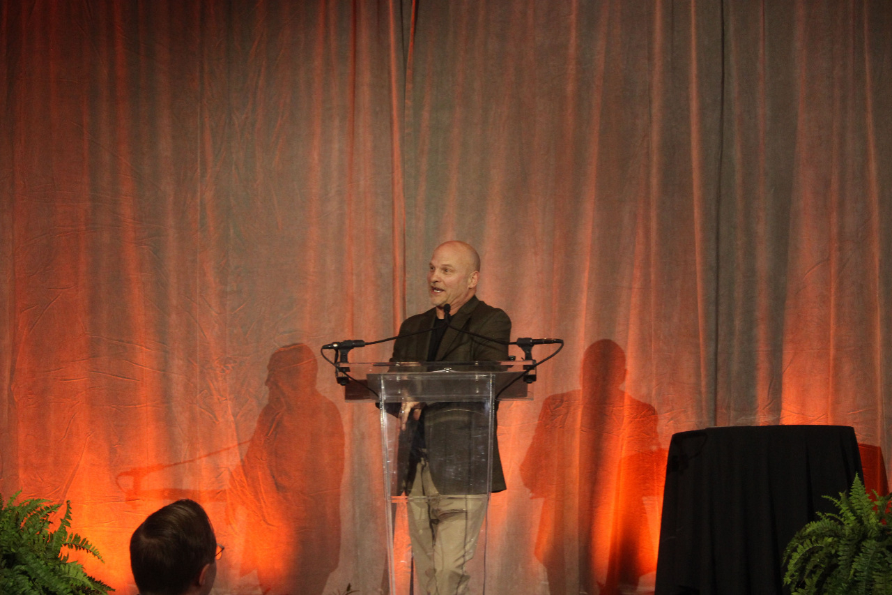 Mr. Terry Morse at a podium giving as speech. Mr. Terry Morse at a podium giving as speech.