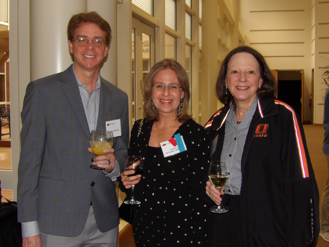 Dr. Daniel Lao Davila, Mrs. Frances and Mrs. Mickey visiting together before banquet begins. Dr. Daniel Lao Davila, Mrs. Frances and Mrs. Mickey visiting together before banquet begins.