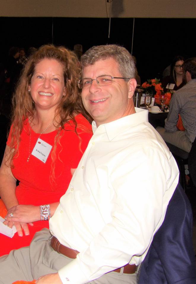 Mr. Steve and Mrs. Kristie Ferguson sitting together at dinner table during banquet. Mr. Steve and Mrs. Kristie Ferguson sitting together at dinner table during banquet.