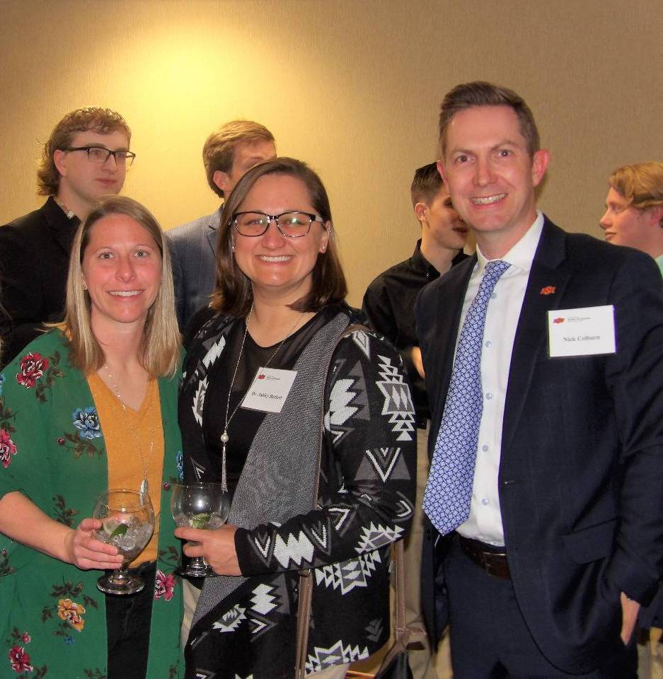 Ms. Maddy Foster, Dr. Ashley Burkett, and Mr. Nick Colburn smiling for a photo together. Ms. Maddy Foster, Dr. Ashley Burkett, and Mr. Nick Colburn smiling for a photo together.