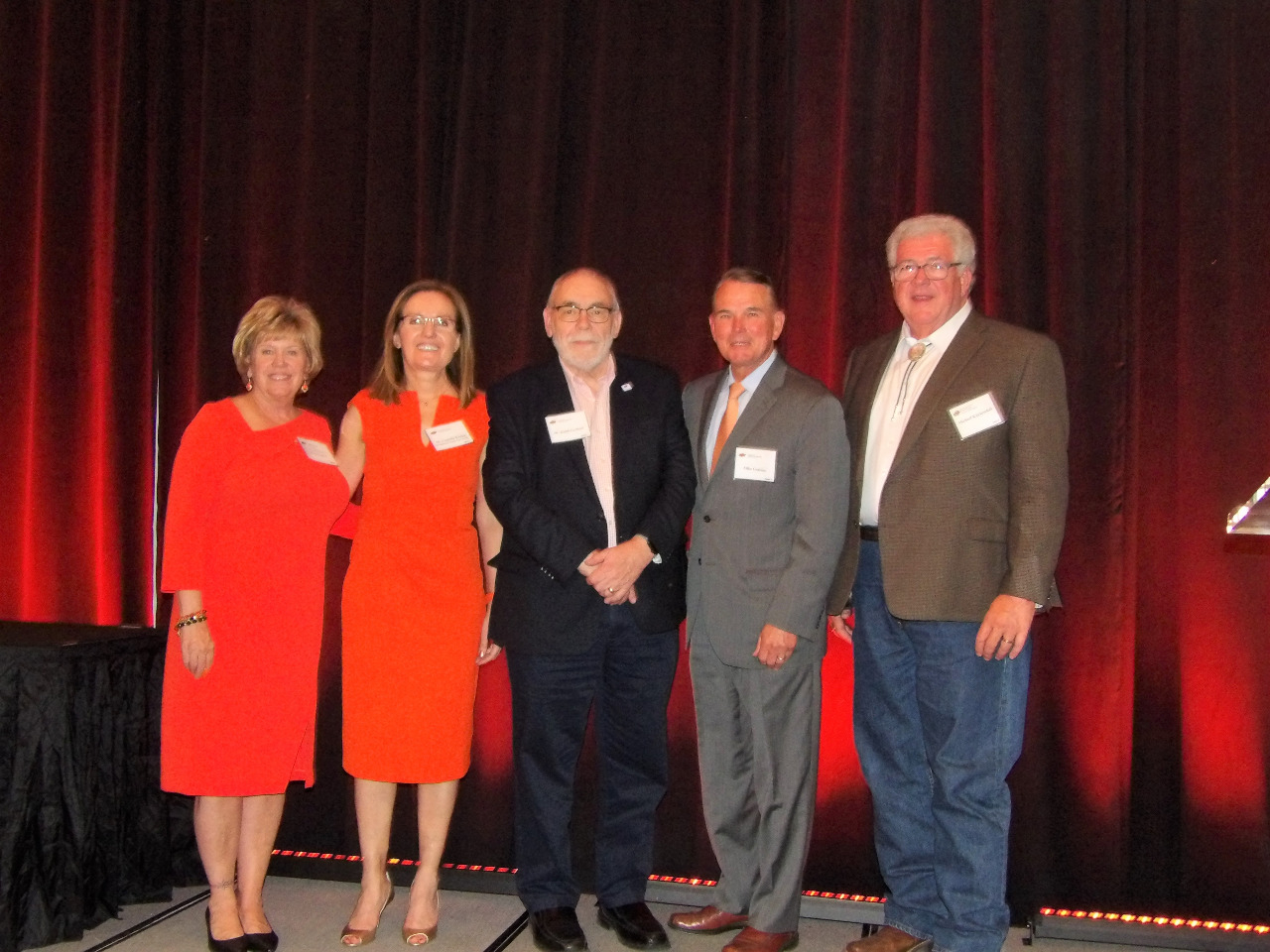 Mrs. Patty Walker, Dr. Camelia Knapp, Mr. Keith Garbutt, Mr. Mike Gaskins and Mr. Michael Kuykendall standing together on stage for a photo. Mrs. Patty Walker, Dr. Camelia Knapp, Mr. Keith Garbutt, Mr. Mike Gaskins and Mr. Michael Kuykendall standing together on stage for a photo.