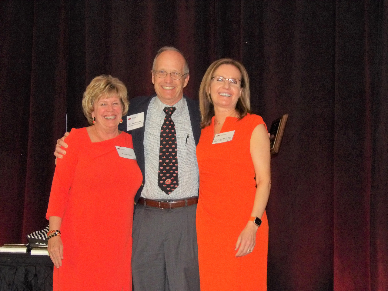 Mrs. Patty Walker and Dr. Camelia Knapp presenting and award to Dr. JIm Puckette. Mrs. Patty Walker and Dr. Camelia Knapp presenting and award to Dr. JIm Puckette.