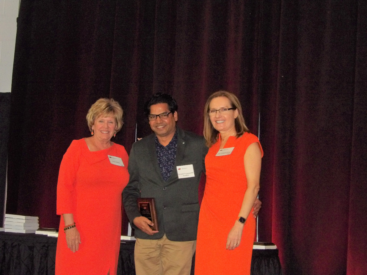 Mrs. Patty Walker and Dr. Camelia Knapp presenting an award to Mr. Sreejesh Seedhar. Mrs. Patty Walker and Dr. Camelia Knapp presenting an award to Mr. Sreejesh Seedhar.