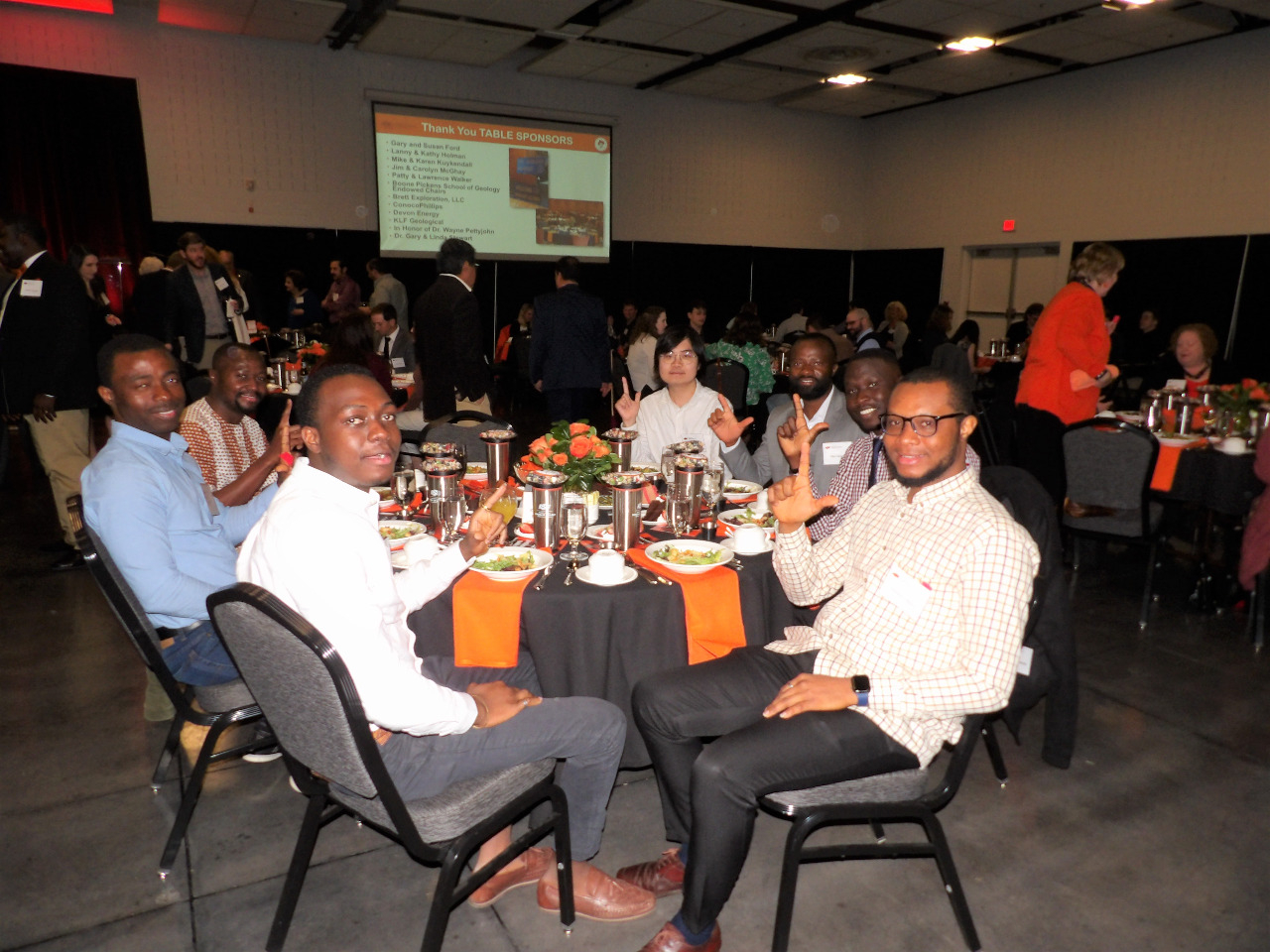 Seven male students showing their cowboy pride by make hand pistol signs. Seven male students showing their cowboy pride by make hand pistol signs.