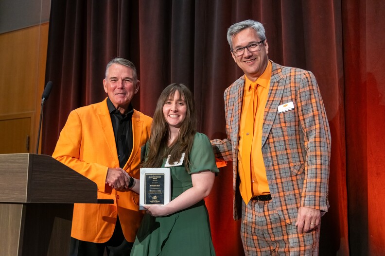 Mike Gaskins and Todd Hailhan giving the Master's Thesis Award to Autumn Graf. Mike Gaskins and Todd Hailhan giving the Master's Thesis Award to Autumn Graf.