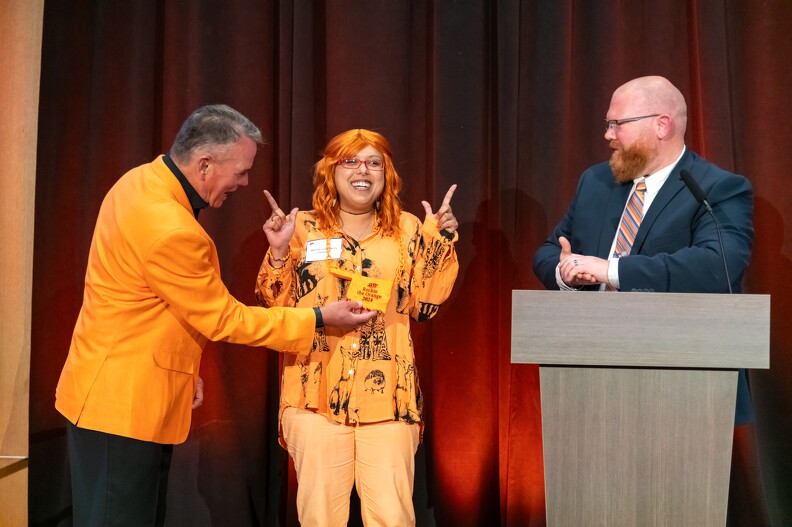 Mike Gaskins and Brandon Spencer giving Monica Hinson first place for the Rock The Orange Award Mike Gaskins and Brandon Spencer giving Monica Hinson first place for the Rock The Orange Award.