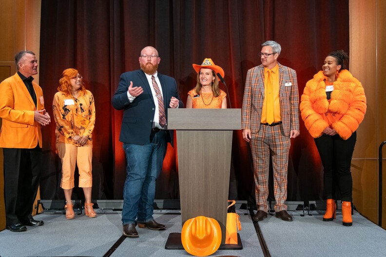 Brandon Spencer asks the audience to vote for 2nd and 3rd place for rock the orange award. Brandon Spencer asks the audience to vote for 2nd and 3rd place for rock the orange award.