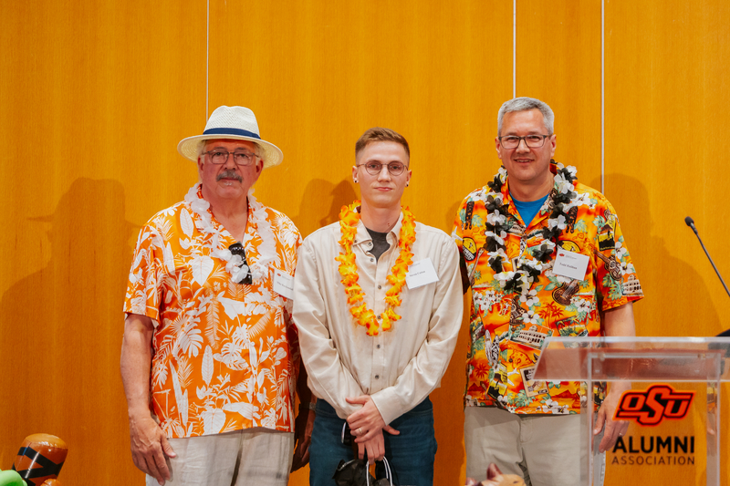 Mike Kuykendall and Todd Halihan giving Steven Cotton his Oustanding Senior Award. Mike Kuykendall and Todd Halihan giving Steven Cotton his Oustanding Senior Award.