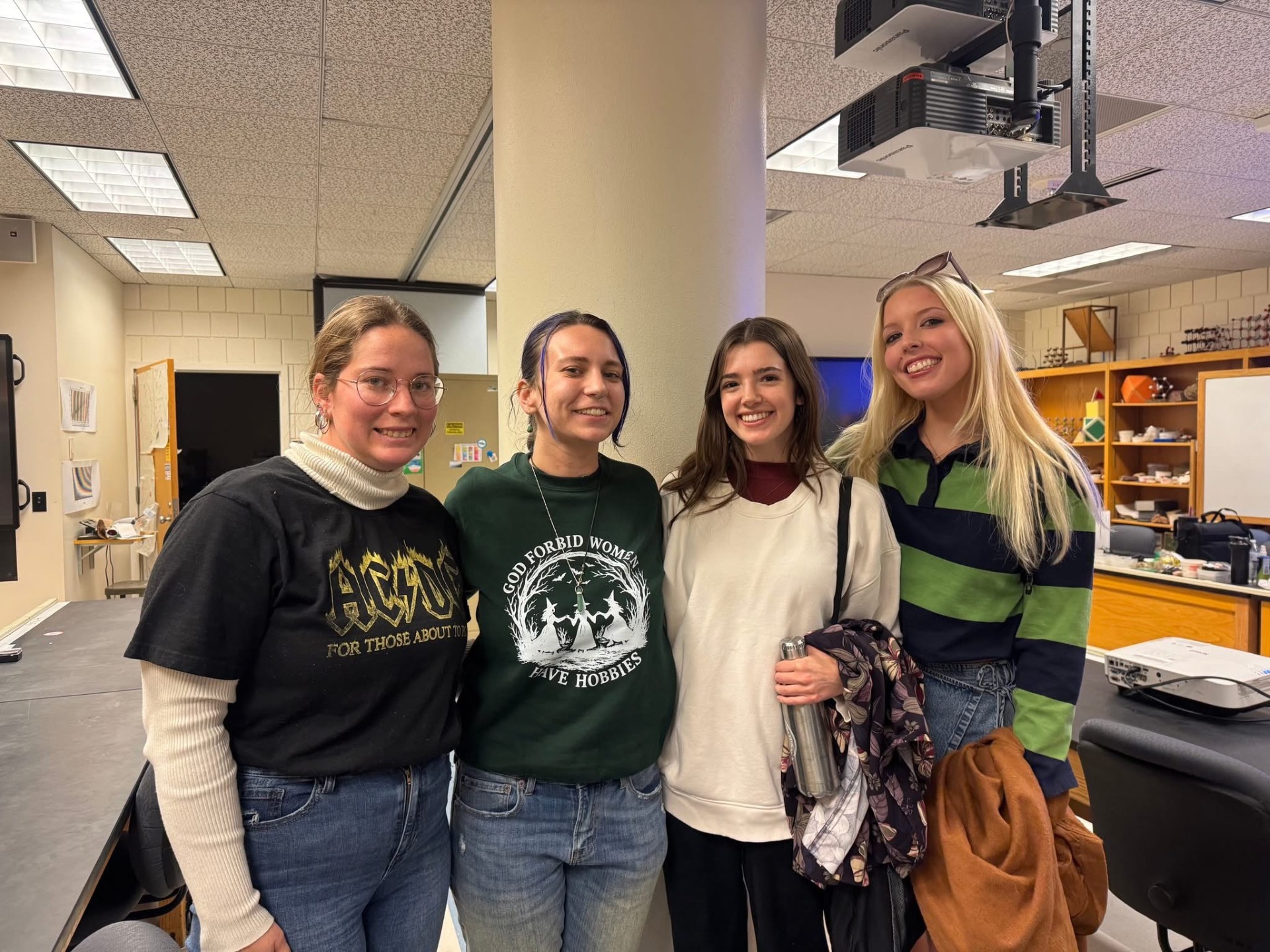 Students Cheyenne, Frost, Ellie and Abby smiling together on their first day in their Volcanology Class. Four female students smiling on their first day in their Volcanolgy class.