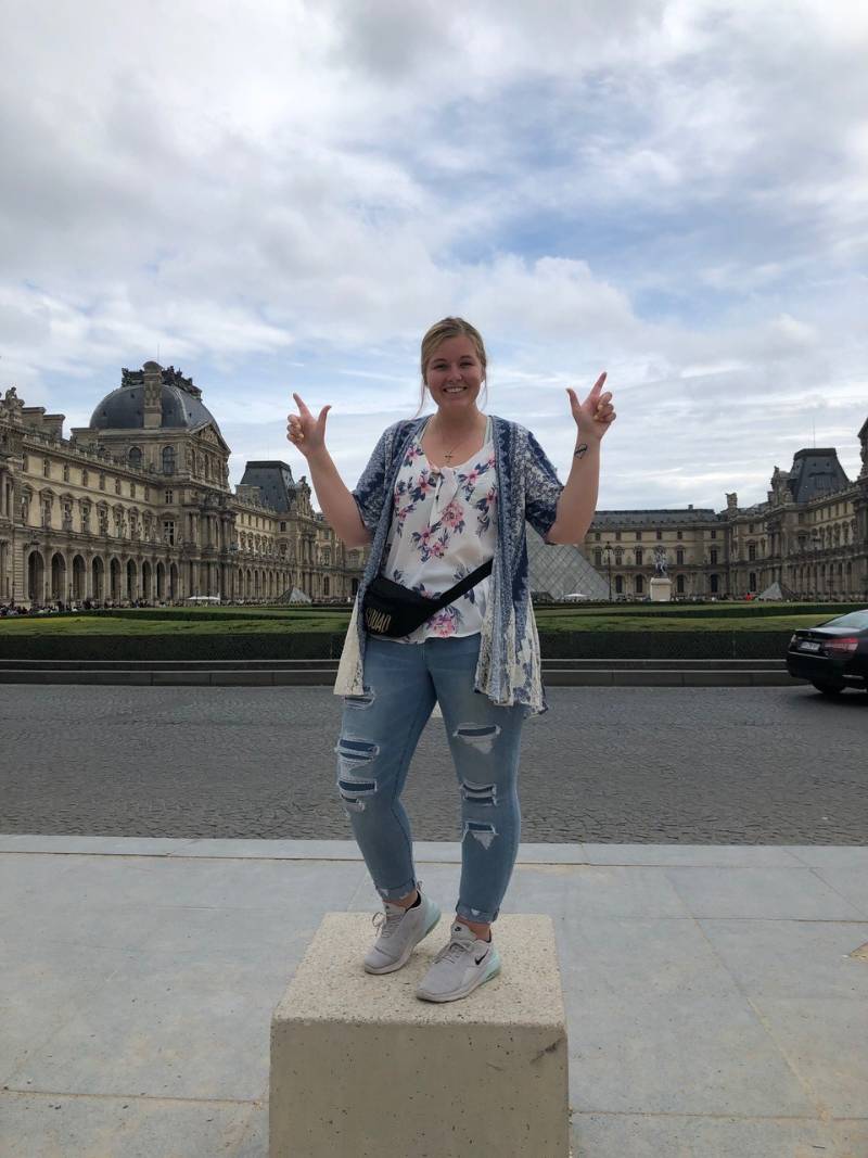 Student in front of the Louvre