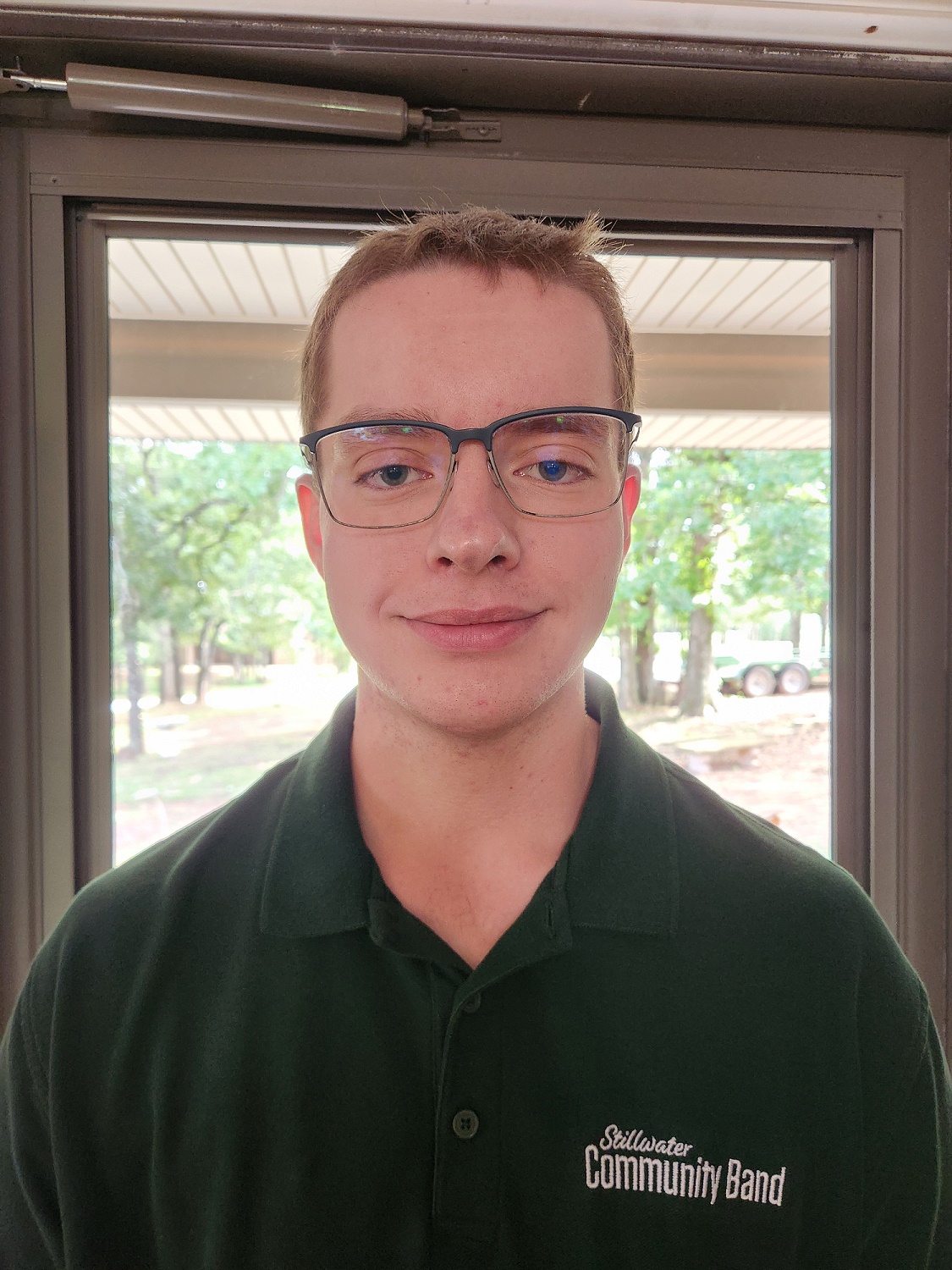 A man with short hair and glasses.