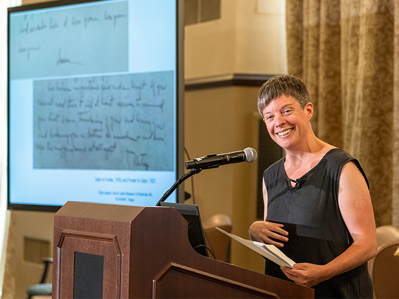 Louise Siddons presenting looking directly at camera and smiling