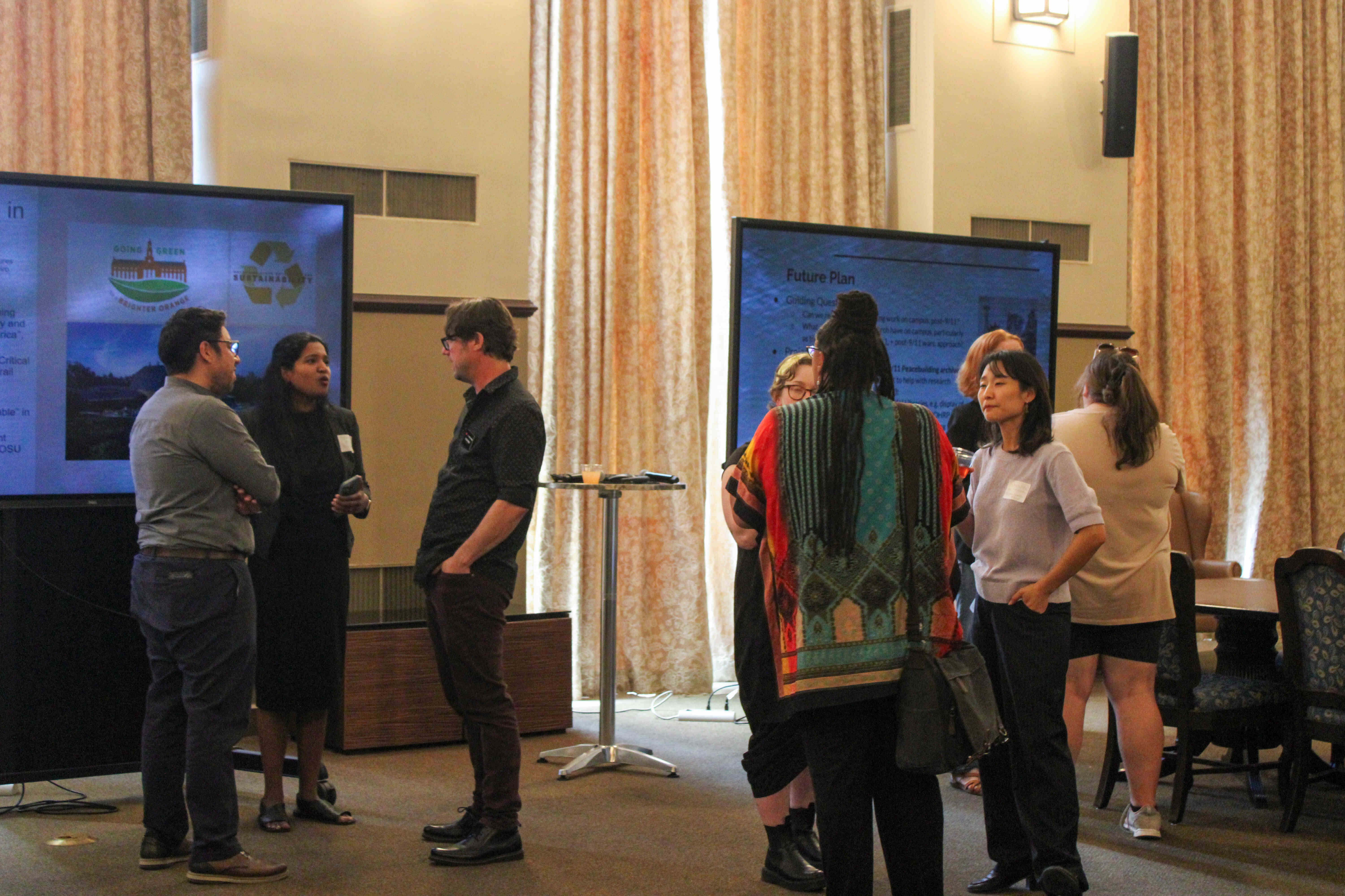 Reception of Fellowship Presentations, people talking in groups