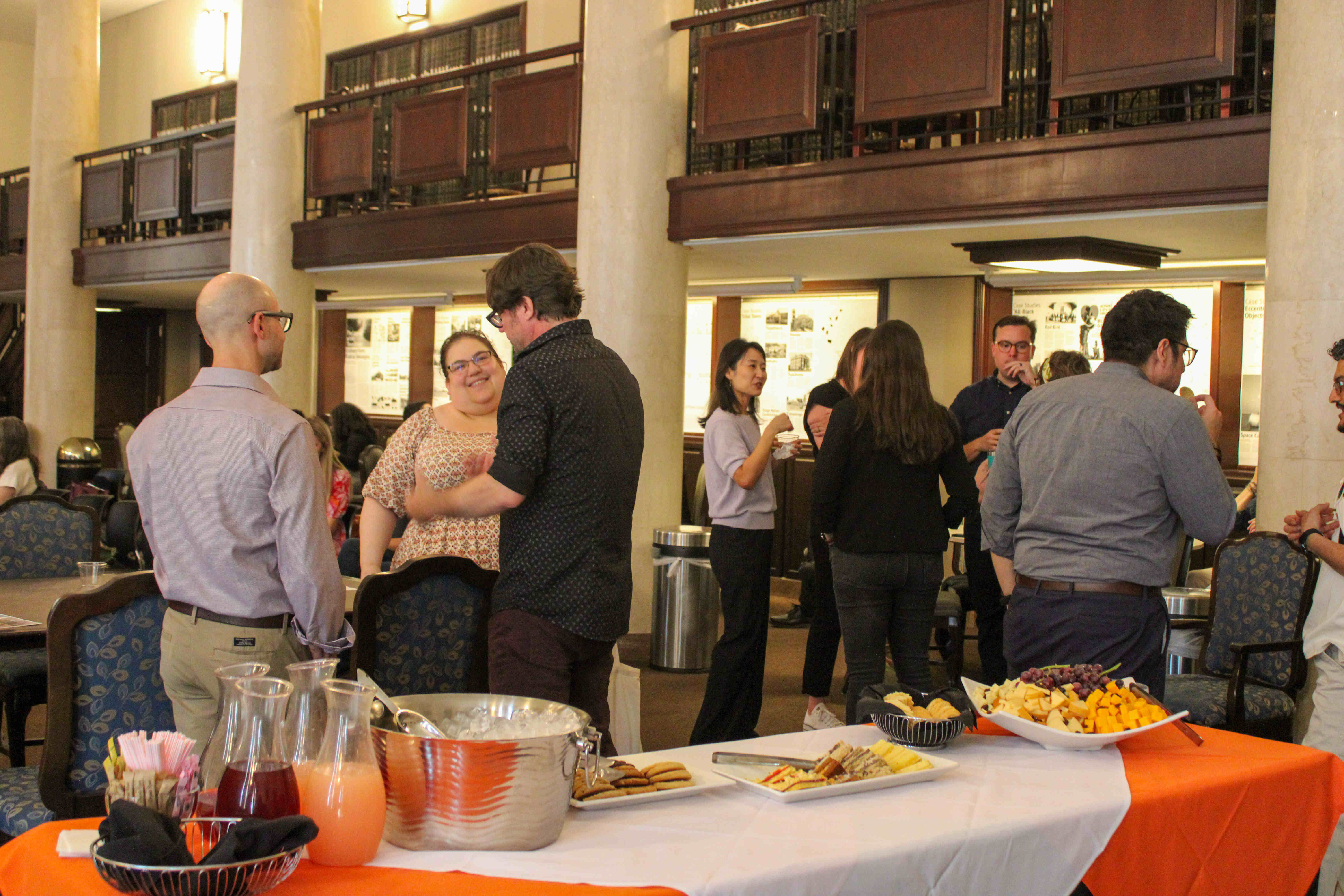 Reception of Fellowship Presentations, people talking in groups