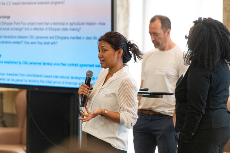 Kamala Shretha speaking into a microphone