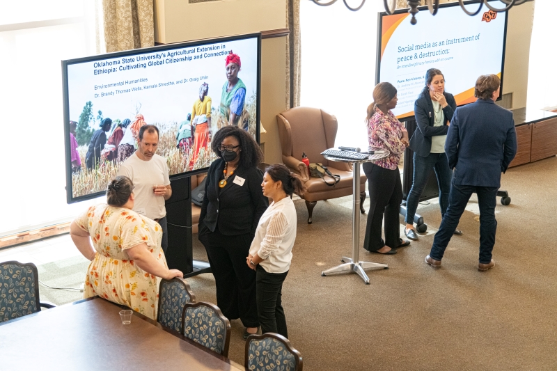 presenters speaking to audience members