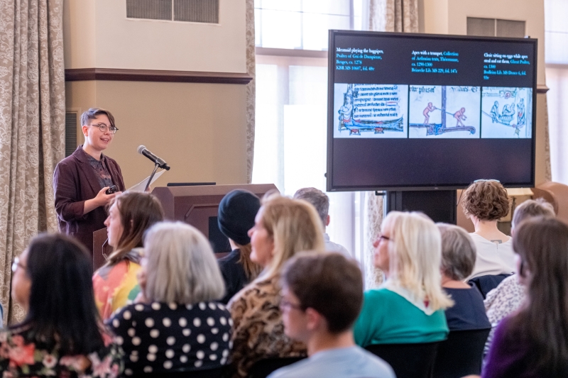 Doyle presenting in front of an audience