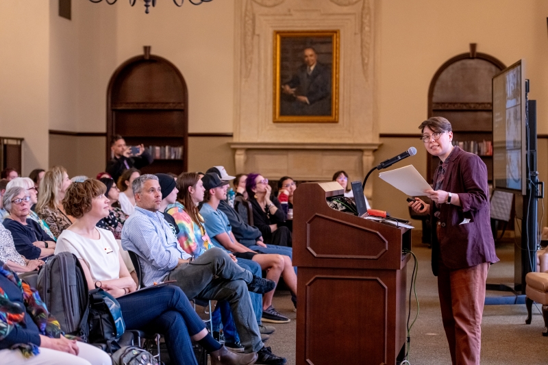 Doyle presenting to an audience