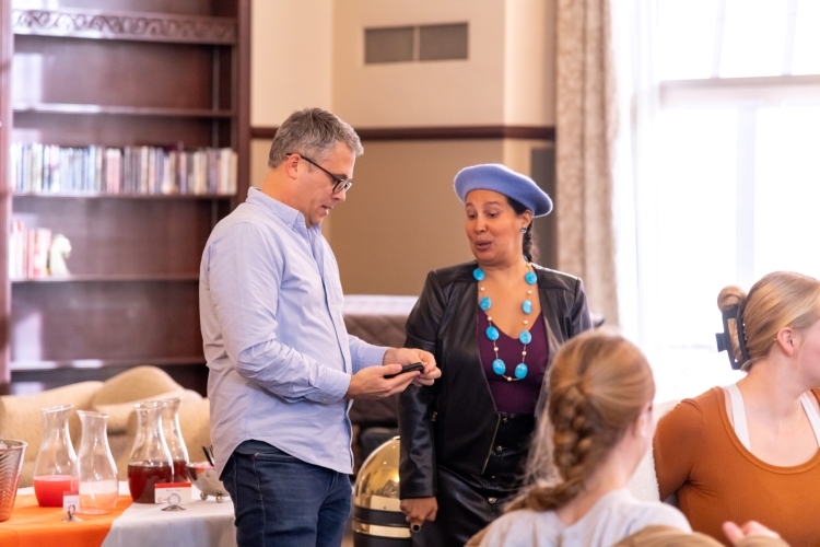 dr reyes-santos standing with a male scholar