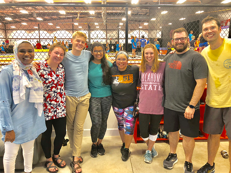 Group of students after jumping on trampolines all hot and sweaty