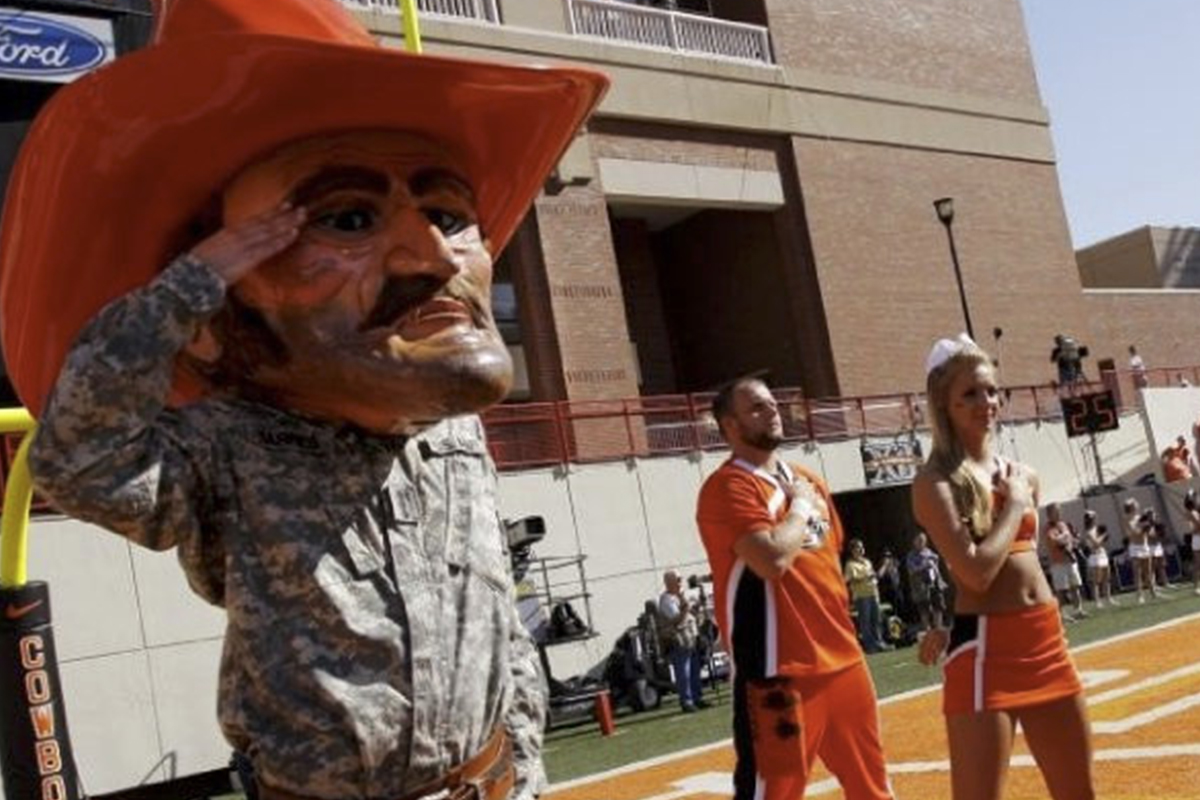 Pistol Pete in military fatigues on the sidelines saluting