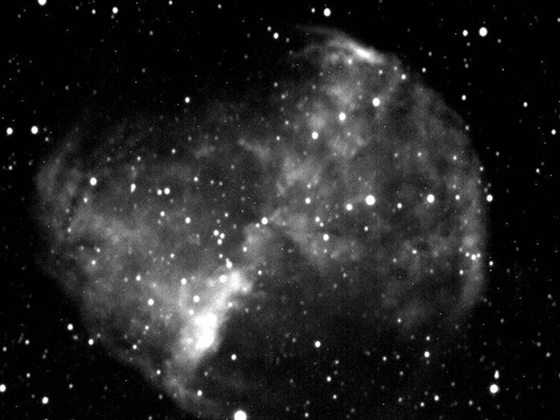 The Planetary Nebula Messier 27 imaged through a red filter.