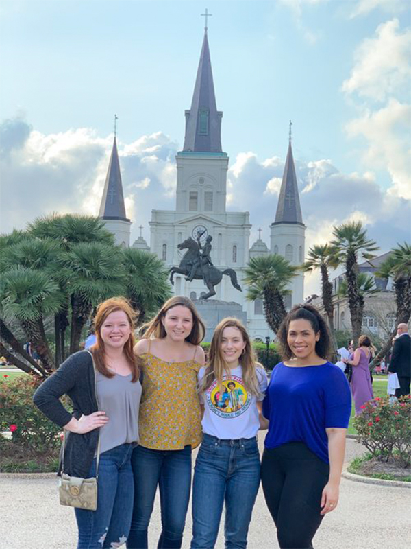Four female students smiling at camera at the Society of Pediatric Psychology Annual Conference