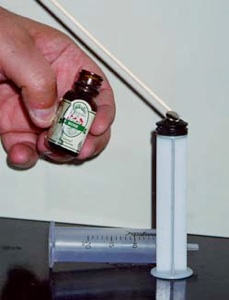 Loading scent onto syringe.