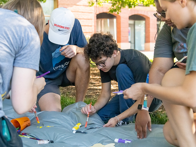 group of students painting during the CAS Amazing Race