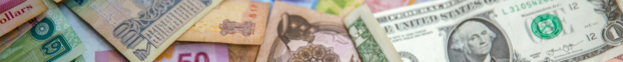 Collection of different types of money, including paper bills.